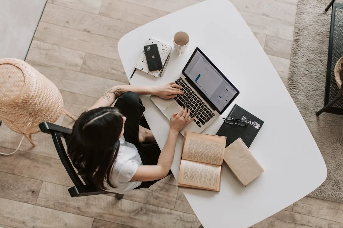 Focused, productive Mexican professional in their well-equipped, ergonomic home office, demonstrating remote work success.