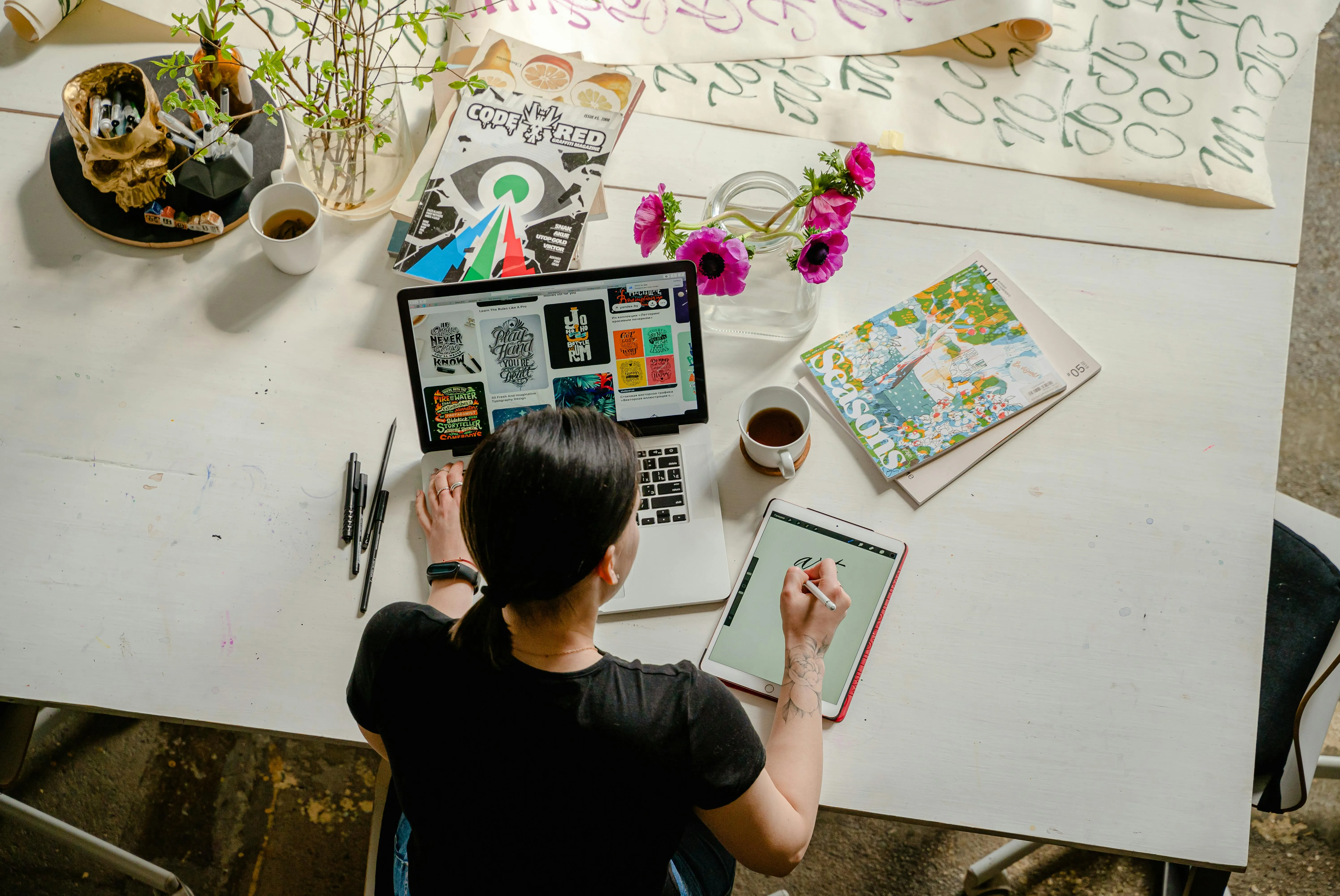 A diverse, collaborative team analyzes metrics on a glass whiteboard inside a modern office, demonstrating effective communication.