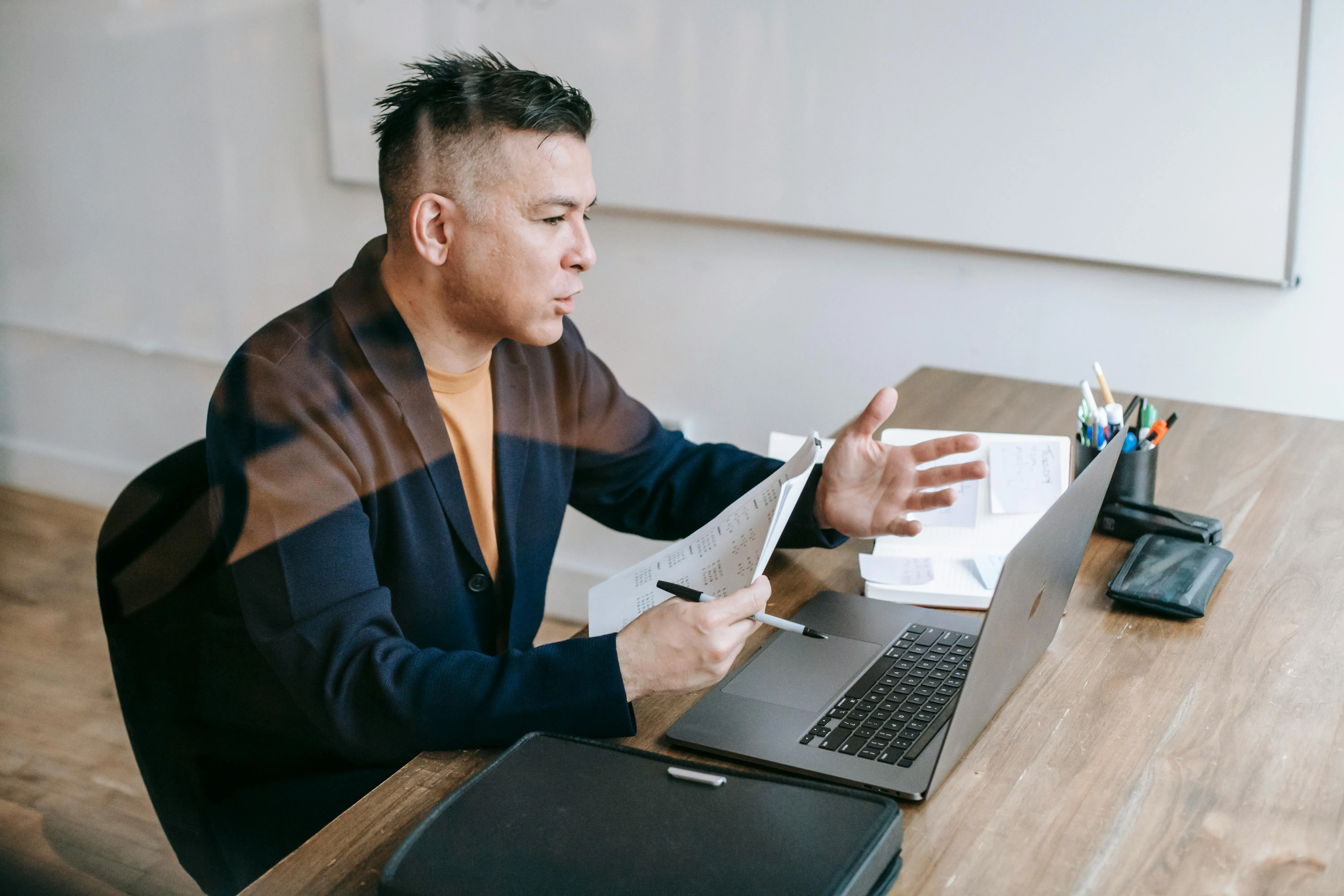 Mexican professional working remotely and securely from their home office, with an expression of confidence and tranquility.